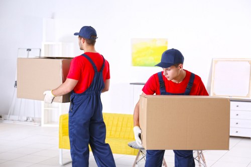 Professional packing team preparing boxes in Enfieldtown home
