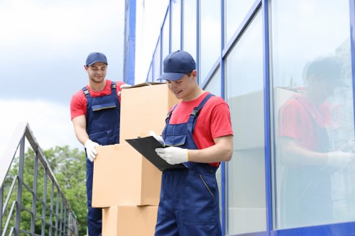 Person organizing boxes in an Enfieldtown storage unit